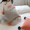 Grey Knitted Cushion with Contrast Pom Poms MND179