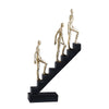 Gold & Black Figure on Stairs Sculpture - B